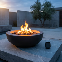 Brookhurst 43 In. W X 13 In. H round Outdoor GFRC Liquid Propane Fire Pit in Carbon with Lava Rocks — Studio Shot